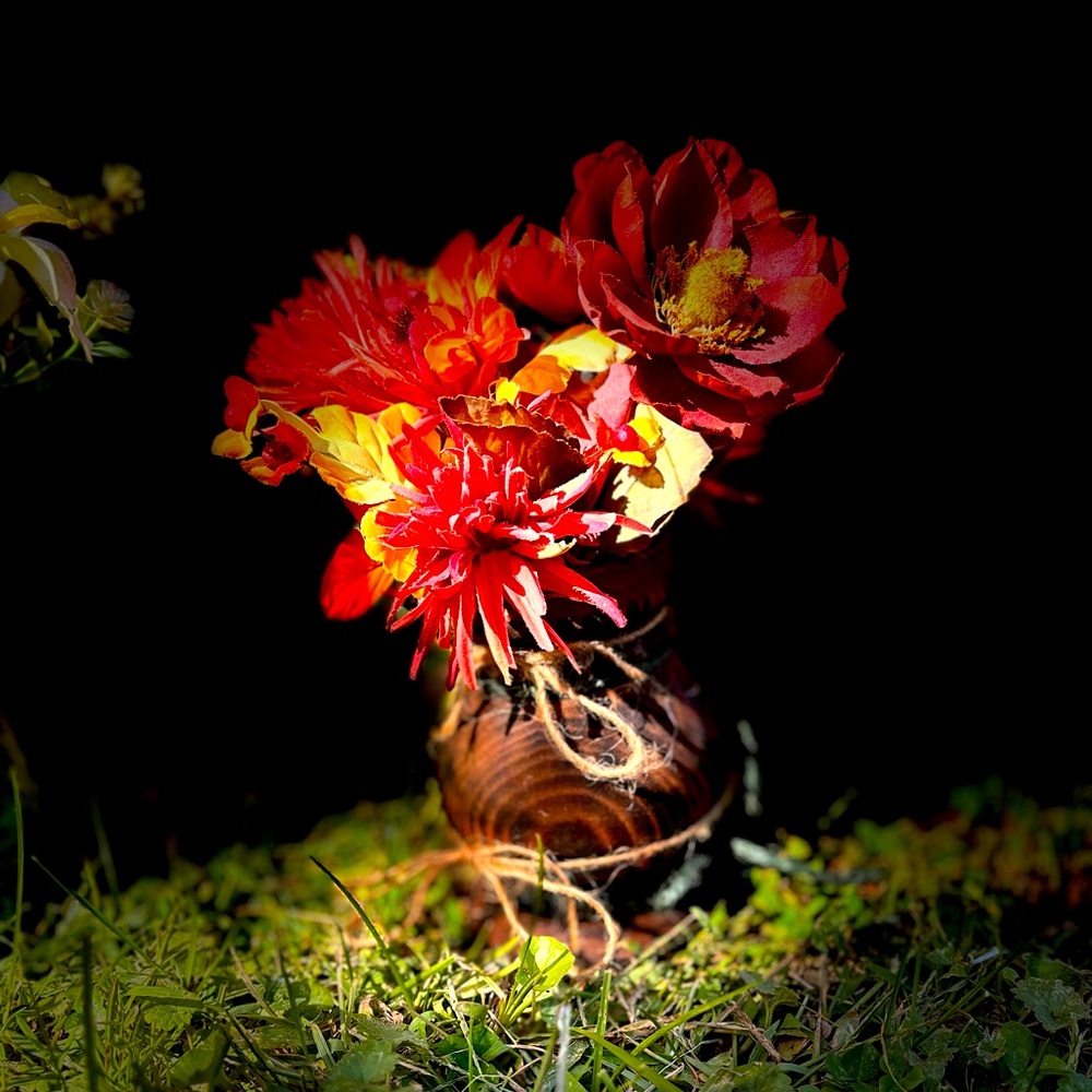 Small fall flower arrangement in wooden vase